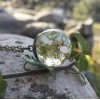Transparent pendant with flower embedding